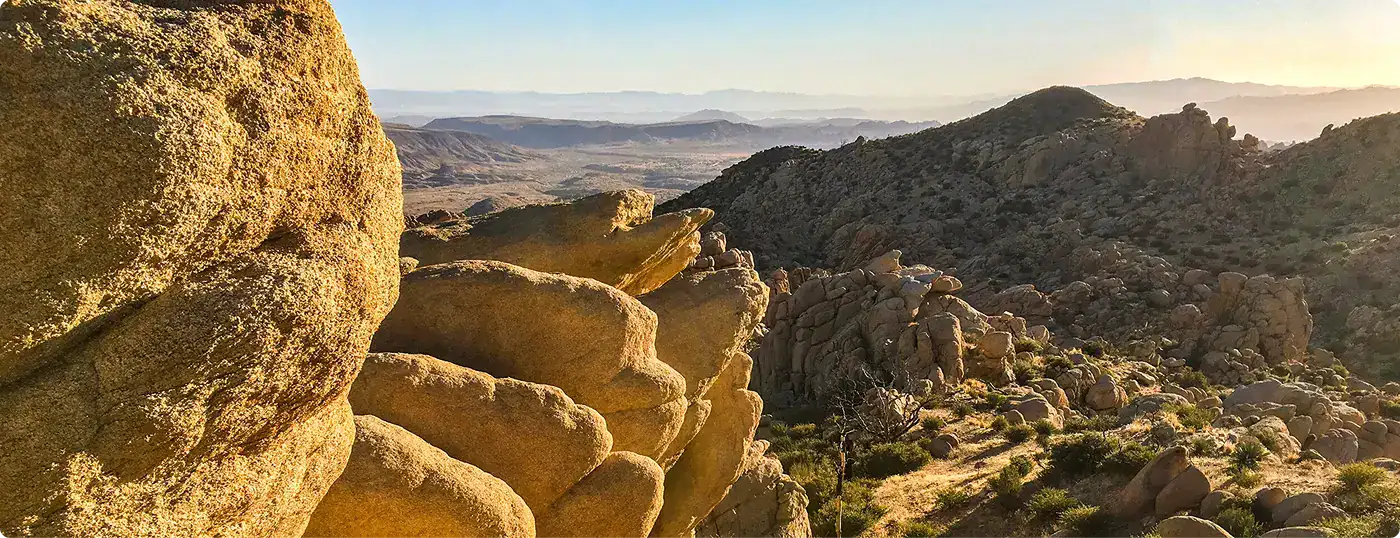 Scenic view of rocky hills and mountains at sunset in the Wildlands Conservancy area.
