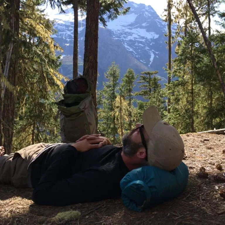 Hiker Resting in Mountain Forest