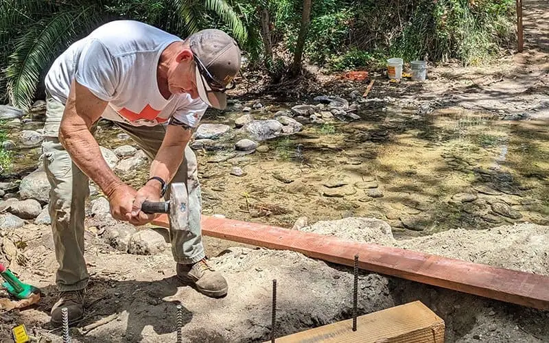 Conservationist Installing Stream Bed