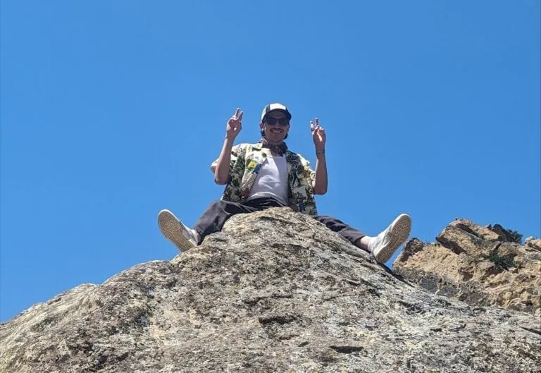 Hiker on Mountain Peak – The Wildlands Conservancy