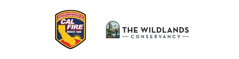 The Wildlands Conservancy logo with a scenic nature background.