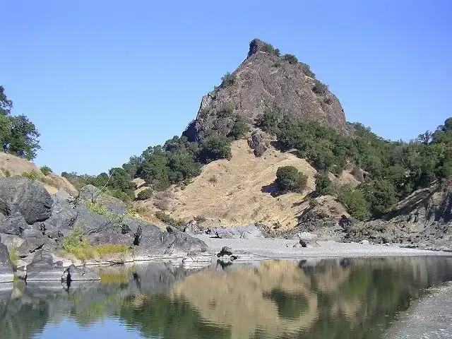 Scenic view of Spyrock Reserve with prominent rock formation and river.