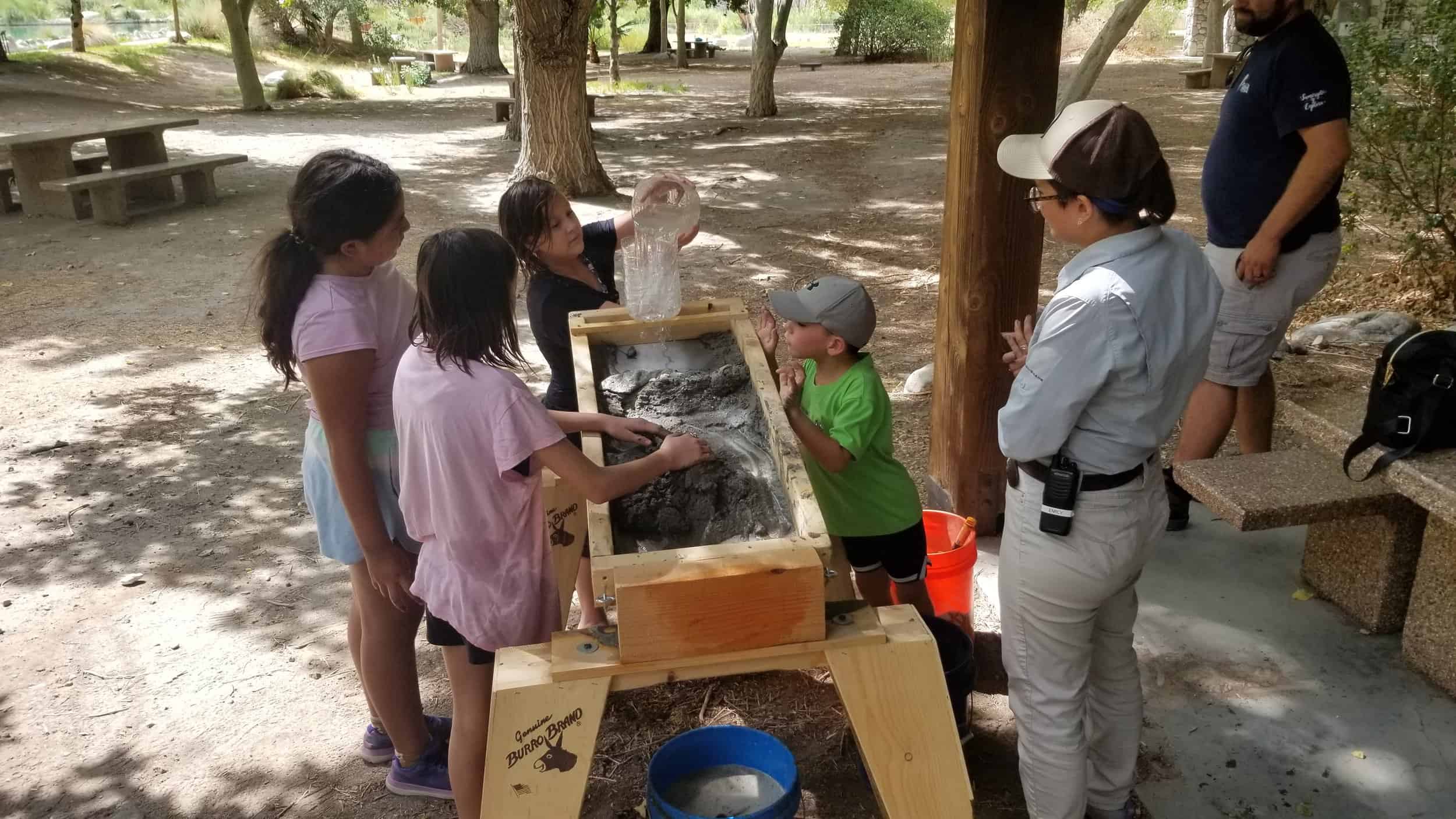 Children engaging in outdoor educational activity at Wildlands Conservancy.