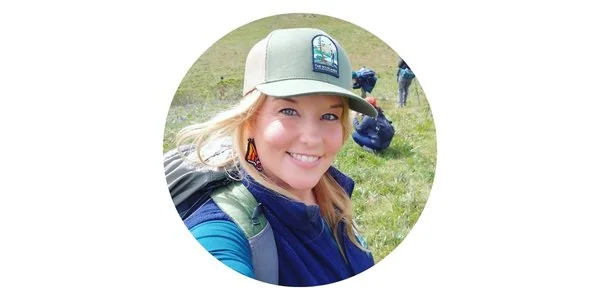 Smiling trail steward with backpack at Jenner Headlands Preserve.