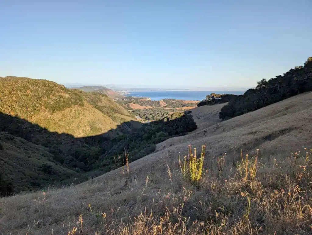Beautiful landscape of Wild Cherry Canyon with rolling hills and distant water view.